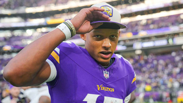 Joshua Dobbs wearing a hat after a Vikings win